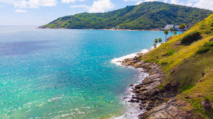 Fototapeta na wymiar Sea island with turquoise water against blue sky