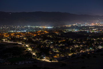 Night hilltop view of suburban Simi Valley homes and streets near Los Angeles in Ventura County, California.