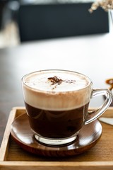 a cup of chocolate milk, a cup of hot chocolate, hot chocolate