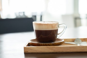 a cup of chocolate milk, a cup of hot chocolate, hot chocolate