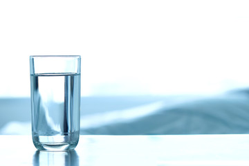 Drink Water.  Pure water in the glass on the table. Health concept