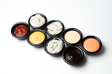 Obraz na płótnie Canvas different sauces in assortment in an black sauces