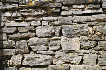 The stones that make up the walls and structures of the amphitheater in the city of Pula, texture
