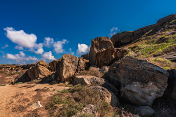 Fototapeta na wymiar Rock fragments against the blue sky