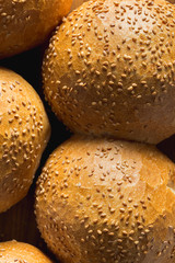 Fresh homemade buns with sesame seeds close up