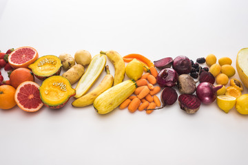 top view of red onions, beetroots, carrots, potatoes, apricots, melon, bananas, zucchini pumpkin...