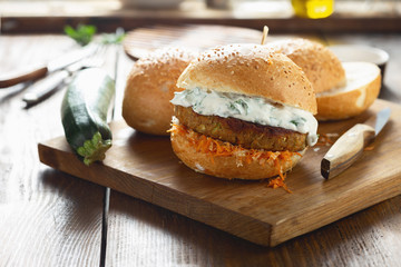 Vegetarian burger on a wooden cutting board
