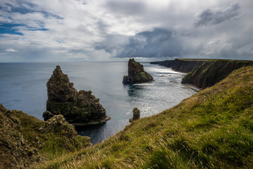 The Duncansby Stacks under a cloudy sky in the late afternoon light