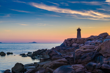 The incredible Pink Granite Shore near the village of Plumanach at sunrise.The coast of Pink...