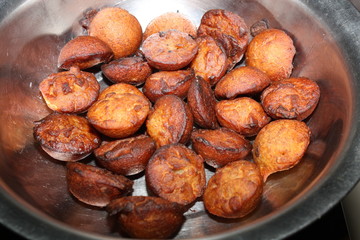 Kerala dessert Unniyappam  in a steel bowl