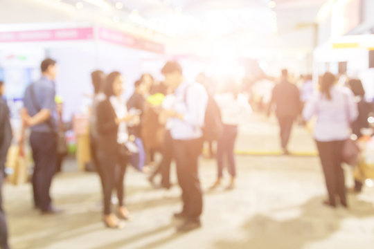 Blurred background of  public exhibition hall. Business tradeshow, job fair, or stock market. Organization or company event, commercial trading, or shopping mall marketing advertisement concept