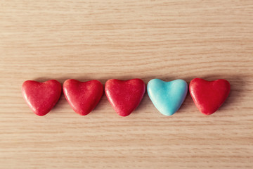 Valentines Day background with hearts shaped on a wooden table