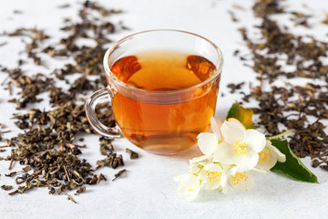 Cup of tea with jasmine flowers