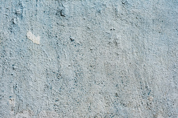 Texture of a concrete wall with cracks and scratches which can be used as a background