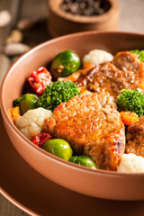 Meat stew with vegetables in a thick sauce.