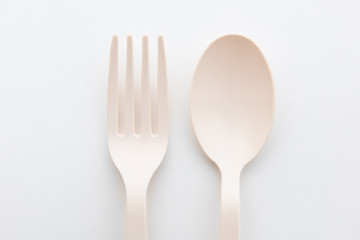 Biodegradable plastic spoon, fork and lunch box on white background isolate
