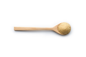 Brown sugar background with wooden spoon