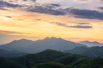 Silhouette of Mountain With Fluffy Clouds during Sunrise at Noen Chang Suek, Kanchanaburi, Thailand