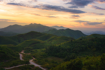 Silhouette of Mountain With Fluffy Clouds during Sunrise at Noen Chang Suek, Kanchanaburi, Thailand