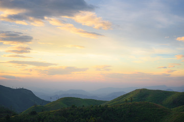 Silhouette of Mountain With Fluffy Clouds during Sunrise at Noen Chang Suek, Kanchanaburi, Thailand