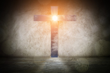 Naklejka premium Christian cross shaping door going through the sunset sky