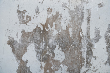 Cracked painted concrete wall background and texture