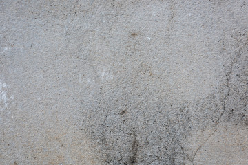 Cracked painted concrete wall background and texture