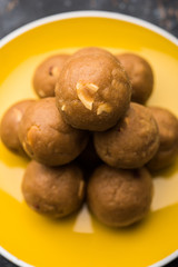 Churma Ladoo / atta laddoo / wheat flour laddu made using ghee and jaggery or sugar. selective focus