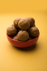 Churma Ladoo / atta laddoo / wheat flour laddu made using ghee and jaggery or sugar. selective focus