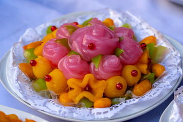 Thai sweet cake. Thai traditional dessert in pink rose flowers shaped. One of nine famous Thai auspicious desserts in Thailand. Rose shape from Khanom Chan