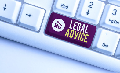 Writing note showing Legal Advice. Business concept for Lawyer opinion about law procedure in a particular situation White pc keyboard with note paper above the white background