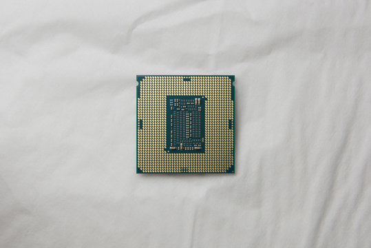 Top view Open the cover (Delid) of central processing unit (CPU) x64 hexa-core processor with hyper-threading, isolated on white background