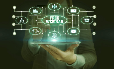 Conceptual hand writing showing Free Webinar. Concept meaning Lecture Workshop Seminar that is transmitted over the Web Woman wear work suit presenting presentation smart device