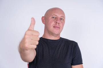 Portrait of an happy bald man, indoors, close up
