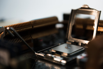 Computer engineer maintenance computer CPU hardware upgrade of motherboard component, PC repair by technician and industry support installation CPU on socket with flare