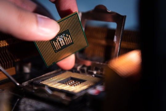 Computer engineer maintenance computer CPU hardware upgrade of motherboard component, PC repair by technician and industry support installation CPU on socket with flare