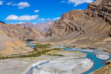 Himalayan mountain landscape along Leh to Manali highway. Blue river and rocky mountains in Indian Himalayas, India