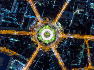 Beautiful roundabout intersection at night view. Aerial view of circle transportation in the city...