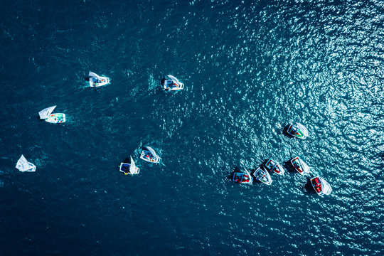 Regatta of small boats on the lake in summer