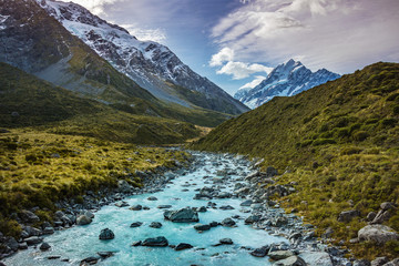 View from Hooker valley track to Aoraki Mount Cook national park, south island, New Zealand show the snow mountain peak, the river and glacier with in the background.