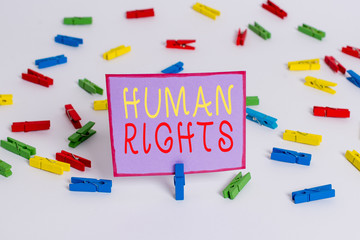 Conceptual hand writing showing Huanalysis Rights. Concept meaning Moral Principles Standards Norms of a showing protected by Law Colored clothespin papers empty reminder white floor office