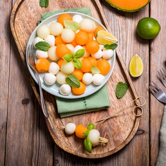 Melon and mozzarella, appetizer or snack, summer salad with cantaloupe melon, square image