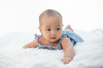 A little boy lying in the bed