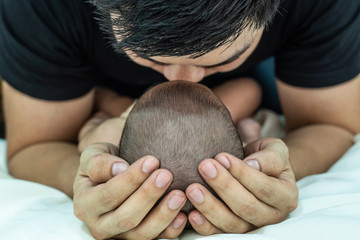 Baby sleeps in father's hand,selective focus