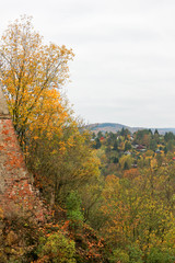 Fototapeta premium Beautiful autumn landscape with old castle wall