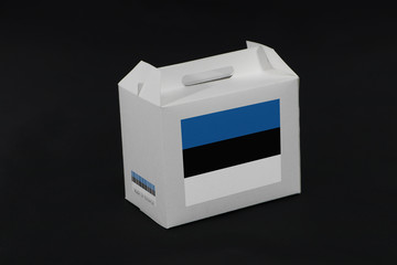 Estonia flag on white box with barcode and the color of nation flag on black background. The concept of export trading from Estonia.