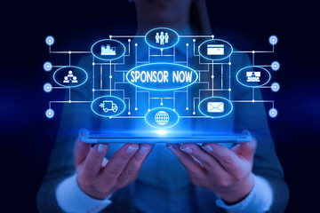 Text sign showing Sponsor Now. Business photo showcasing paying or investing in project with no profit back for you Woman wear formal work suit presenting presentation using smart device