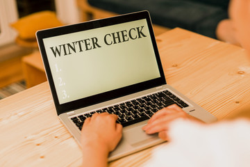 Word writing text Winter Check. Business photo showcasing Coldest Season Maintenance Preparedness Snow Shovel Hiemal woman laptop computer smartphone mug office supplies technological devices