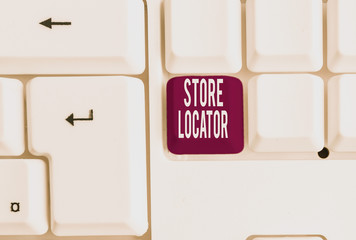 Writing note showing Store Locator. Business concept for to know the address contact number and operating hours White pc keyboard with note paper above the white background