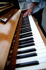 Hands playing the piano close up